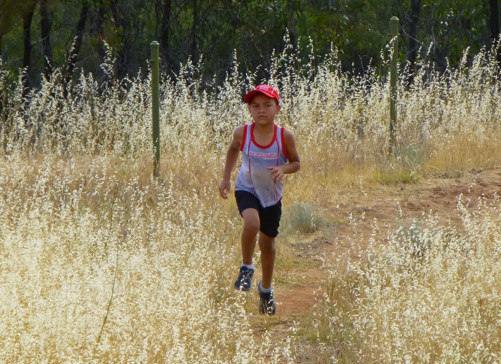 Alex looks relaxed, thoughtful and determined.